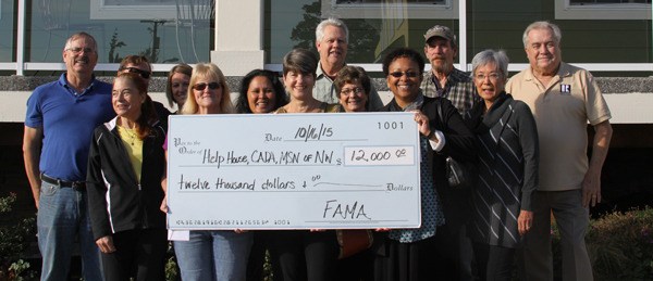 Organizers of the Oak Harbor Pigfest and recipients of the $12