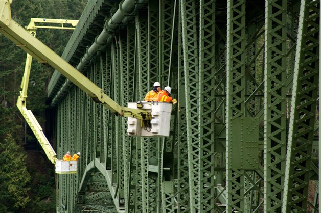 Two teams of bridge inspectors examine the south span of Deception Pass bridge Tuesday morning