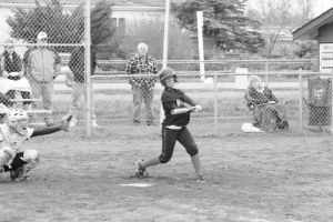 Coupeville’s Julie Huddleston collects one of her two base hits in Monday’s 14-0 loss to Cedarcrest.