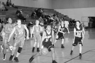 Wildcat seventh-grader Jalani Bobo takes the ball to the basket in Saturday’s game against the Mount Baker Dynamite.