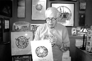 Coupeville artist Roger Purdue shows the logo he created for the 2008 Penn Cove Water Festival