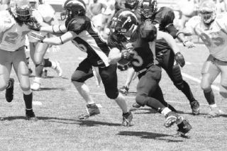 Running back Vann Vetch breaks off a nice run. Vetch was  one of the few bright spots for the Skagit Valley Lightning in Saturday’s loss to the South Sound Shockers in the final game of the season.