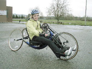 CeCe Black demonstrates the use of a hand cycle