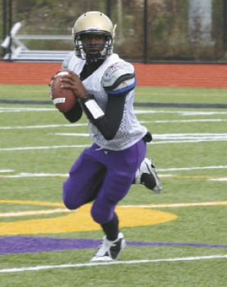 New starting quarterback J Jordan rolls out and looks downfield to find an open pass receiver.