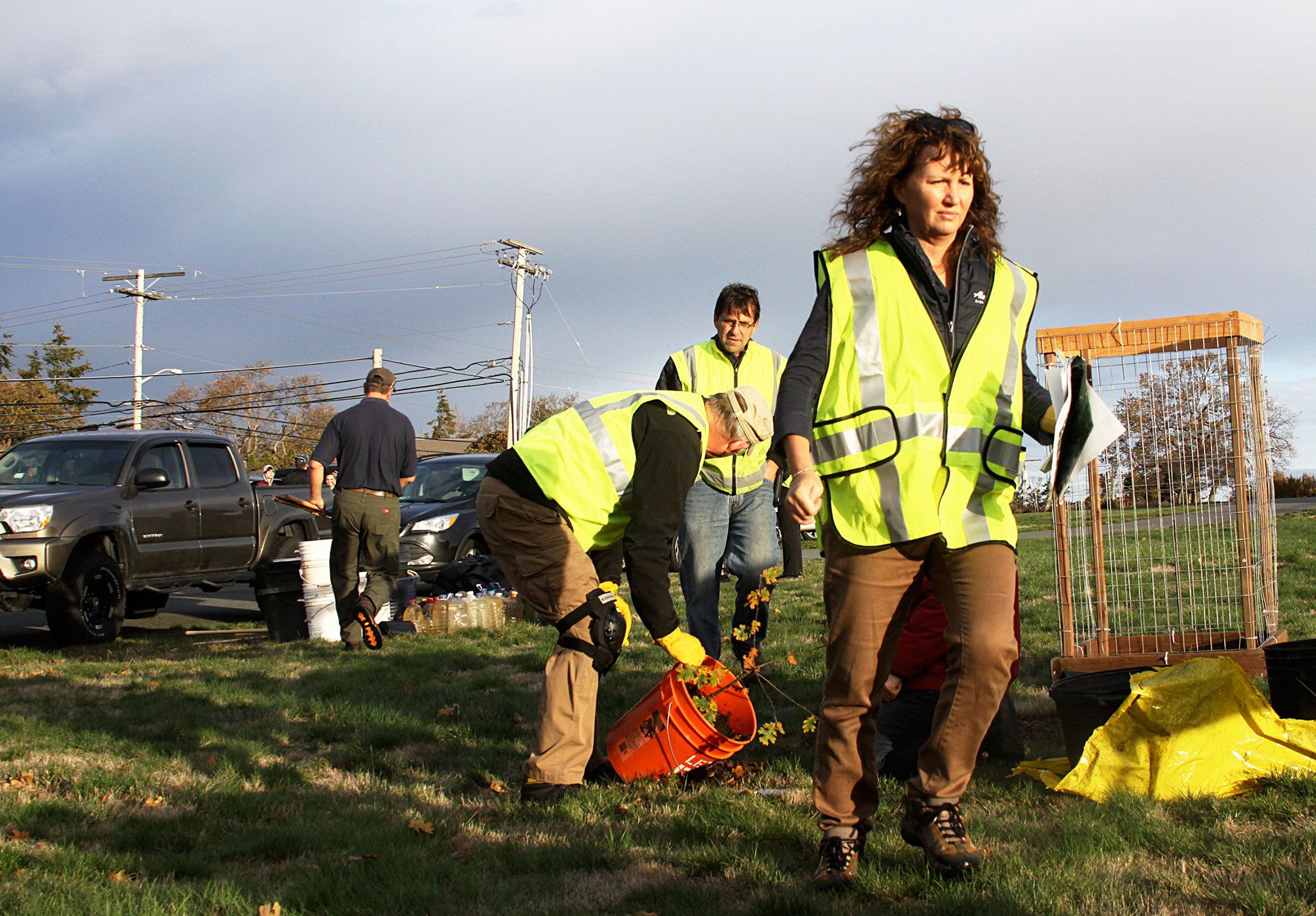 Laura Renninger, president of the Oak Harbor Garry Oak Society, prepares for the planting of 30 new Garry oak trees on Navy property in Oak Harbor Friday.