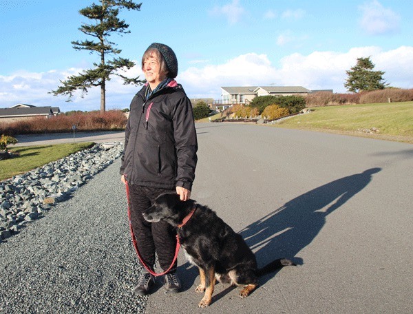 North Whidbey resident Christine Laing looks at the sky from the spot where she recently saw a UFO.