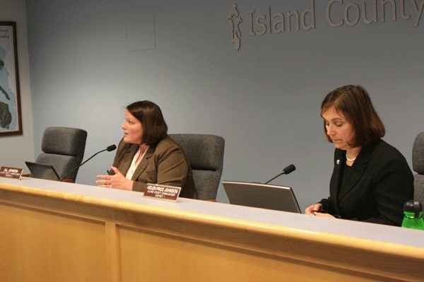 Island County Commissioner Kelly Emerson’s chair sits empty during a regular meeting of the board. Commissioners Jill Johnson