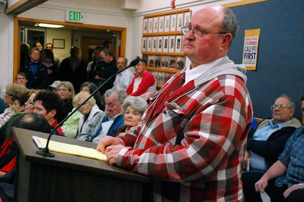 Oak Harbor resident George Holtry speaks at a city council meeting Tuesday concerning the recent firing of Fire Chief Mark Soptich. Holtry was one of over 20 people to do so at the meeting.