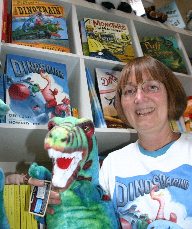 Let your imagination roar with “Dinosoaring” -- author Deb Lund certainly did. Her new children’s book about dinosaurs heading off on a sky-high adventure will soar onto shelves this week. Pictured behind her are other books she has written that are available at the Honey Bear in Coupeville.