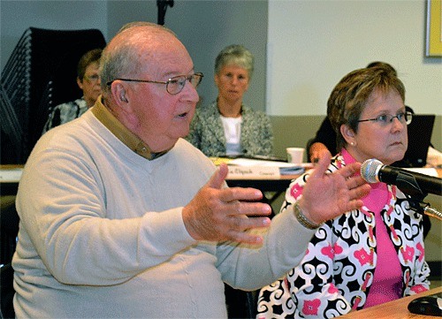 Retired Adm. Lyle Bull joins Oak Harbor City Councilwoman Beth Munns during a presentation to the Washington State Legislature Joint Committee on Veterans’ and Military Affairs at the Oak Harbor Library.