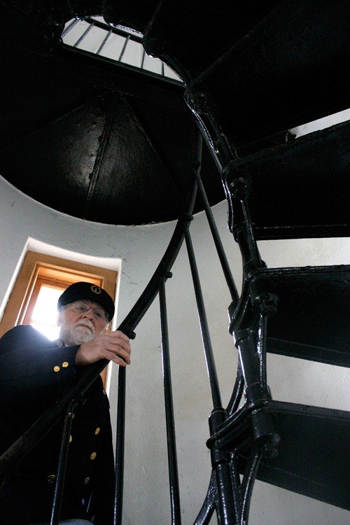 Admiralty Head Lighthouse docent Lee Hart walks the path many lightkeepers walked up the Admiralty Head Lighthouse tower. He’ll tell the lightkeepers’ stories on Monday