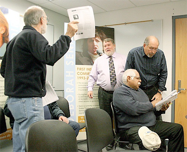 Island County Planner Bob Pederson and Coupeville Planner Larry Kwarsick explain the new Ebey’s Landing National Historical Review design guidelines before a public hearing Monday morning.