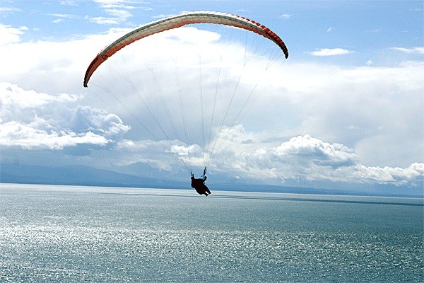 A paraglider soars above Fort Ebey State Park. A proposal is being considered by the Washington State Parks and Recreation Commission that would allow such activity to take place on the bluff trail at Ebey’s Landing.