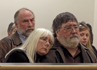 Barbara Moran and Bob Baker listen to testimony Thursday by their lawyer