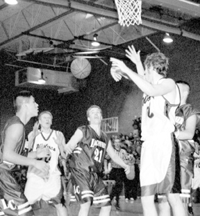 Coupeville’s Chris Good goes strong to the hoop in the second half of the Wolves’ 59-54 victory over Darrington of Tuesday. Good finished the contest with a game-high 26 points and 15 rebounds.