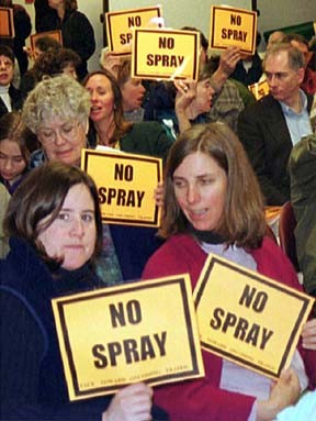 Opponents of roadside herbicide spraying pack the Island County Commissioners’ meeting on Monday.