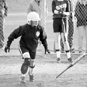 Oak Harbor second baseman Sarah Bottenberg takes off for first after picking up a base hit in the bottom of the seventh inning against Arlington.