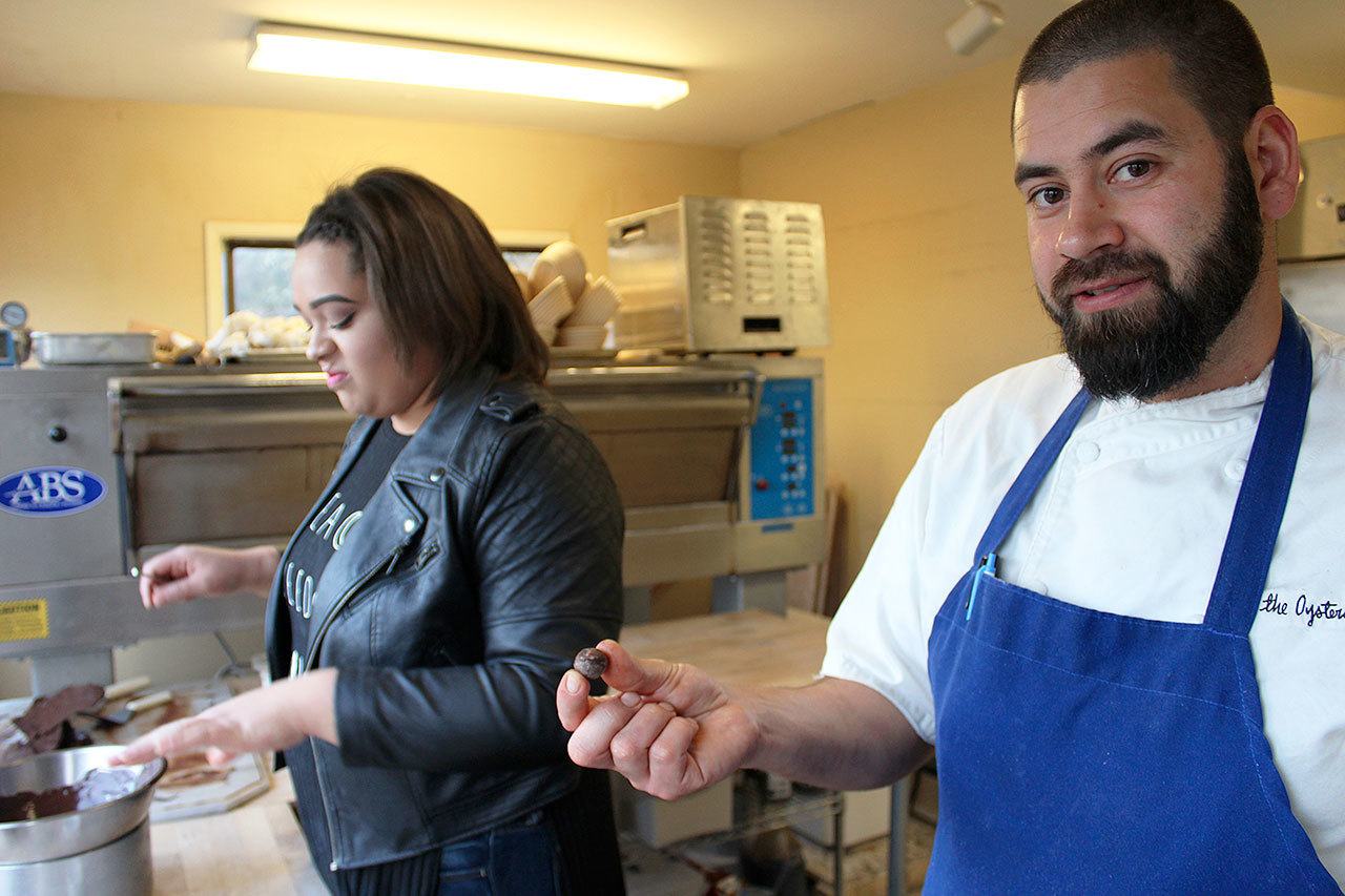 Ciera St. Onge makes truffles at Oystercatcher in Coupeville, a treat that restaurant owner Tyler Hansen will make available at the Coupeville Chocolate Walk on Saturday, Feb. 11. Photo by Daniel Warn/Whidbey News-Times