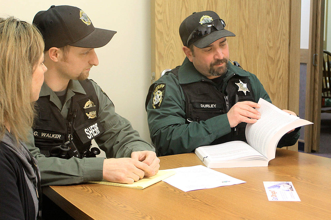 Photo by Evan Thompson/South Whidbey Record                                A new outreach team aimed at getting opioid drug addicts into recovery meets recently at Island County Sheriff’s South Whidbey precinct in Freeland. From left to right are Colleen Keefe, public health nurse, deputies Grant Walker and Brent Durley and outreach advocate Carolyn Pence.