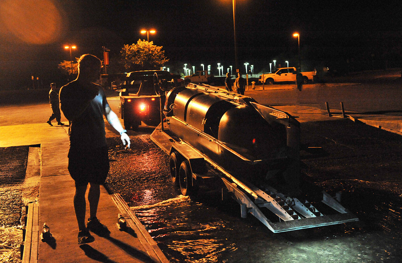 Sailors assigned to Naval Special Warfare Group THREE launch a wet-submersible in the Puget Sound during a training activity. The U.S. Navy has conducted training in the Pacific Northwest for more than 70 years, including naval special operations training for the past 30 years. (U.S. Navy Photo by Chief Mass Communication Specialist Grant Probst.)