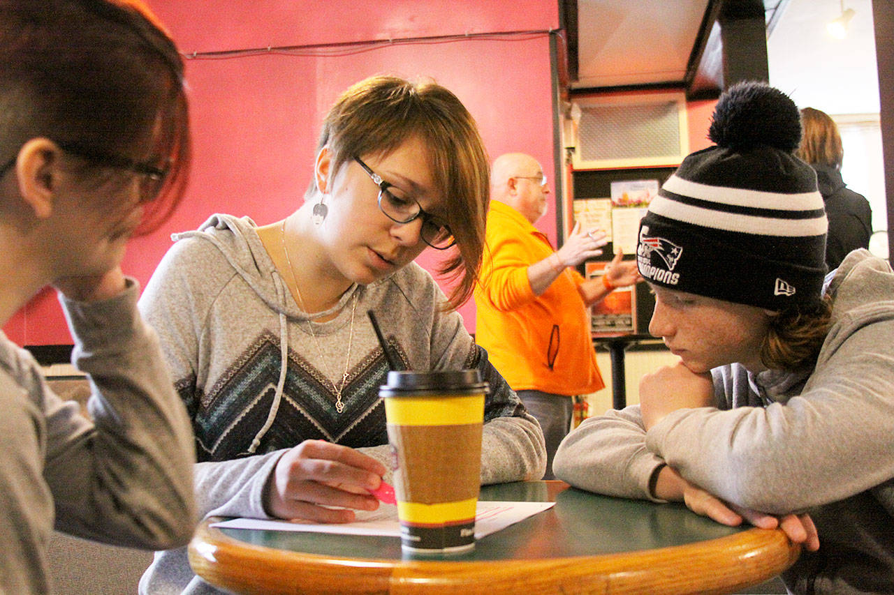 Teenage emcees Hailey Winch, left, Keelie Partridge and Harrison Keating study a script Thursday, April 6, 2017 at the Whidbey Playhouse in preparation for the second Whidbey Has Talent competition at Oak Harbor High School Sunday. Photo by Ron Newberry/Whidbey News-Times