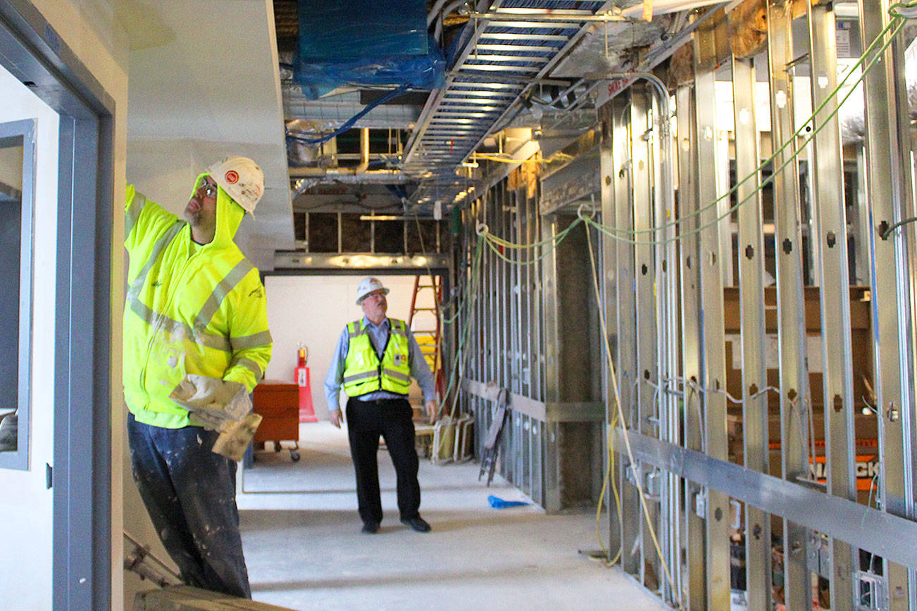 Photo by Patricia Guthrie/Whidbey News Times An innovative energy system being installed at WhidbeyHealth Medical Center’s new wing is expected to significantly save money and decrease dependence on fossil fuels. George Senerth; executive director of facilities engineering; checks on construction progress. The heating and cooling system saves energy by tranferring warm air where it is needed from unused rooms. Photo provided by Coffman Engineers, Inc.