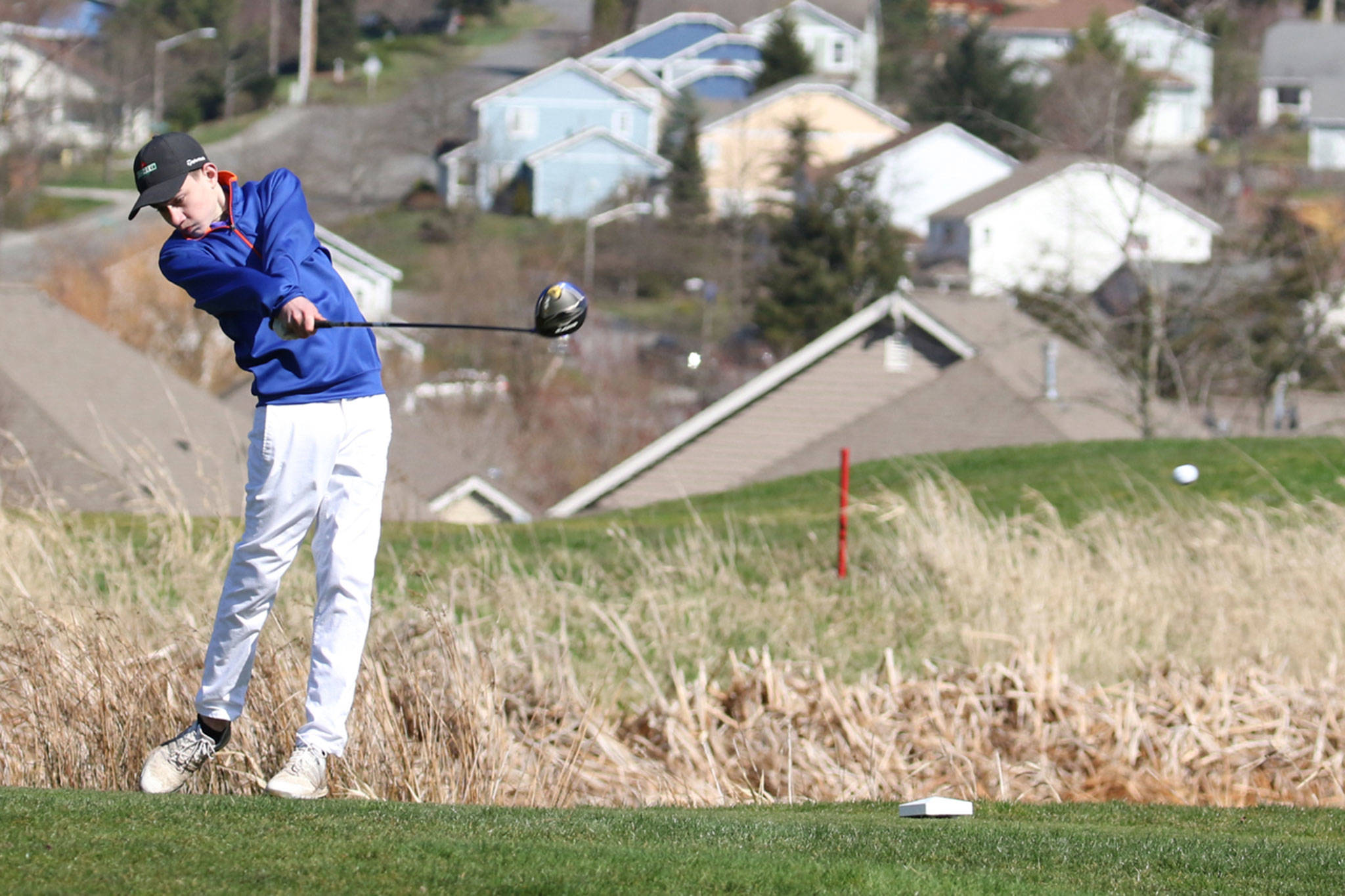 Nick Krantz, shown here teeing off at home meet earlier this spring, placed fifth in the Wesco North tournament Monday. (Photo by John Fisken)