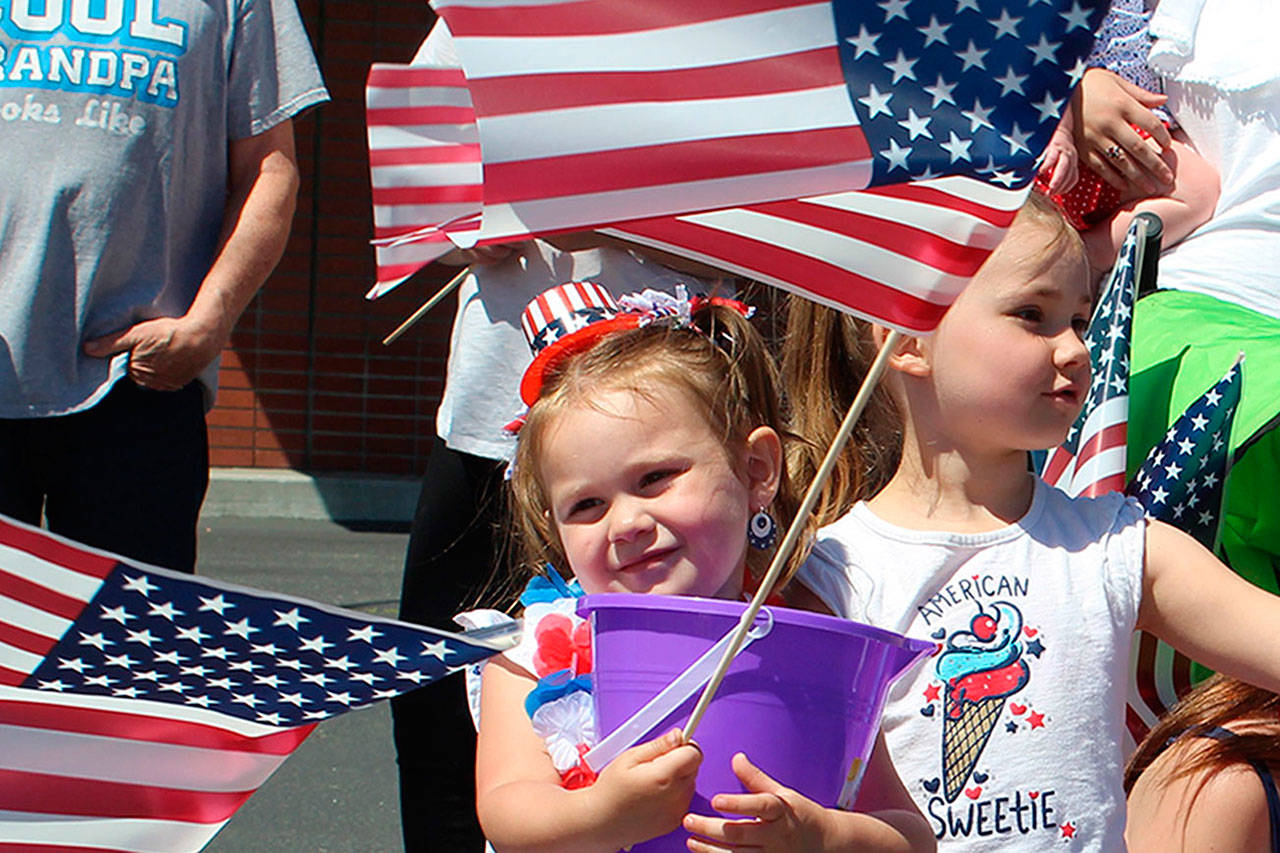 Kids, flags and families salute America’s birthday at Oak Harbor parade ...