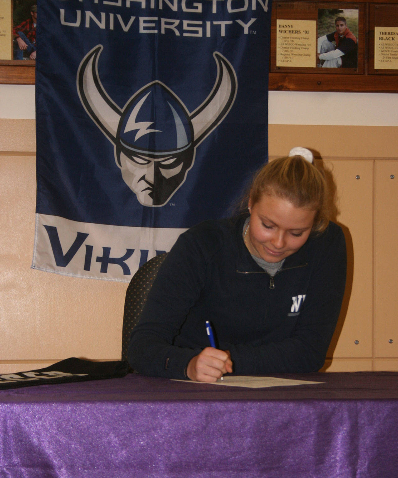 Caylie Etherington signs a letter of intent to play soccer at Western Washington University. (Photo by Jim Waller/Whidbey News-Times)