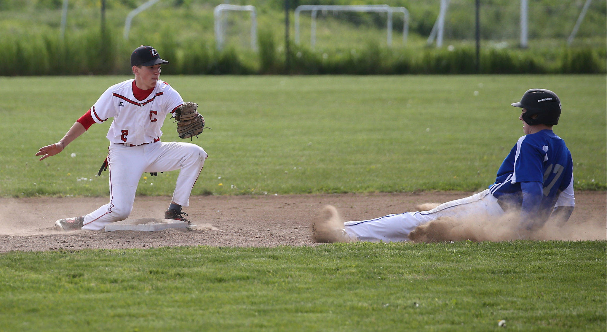 Returning Coupeville second baseman Nick Etzell tags out a Chimacum base runner last season. (Photo by John Fisken)