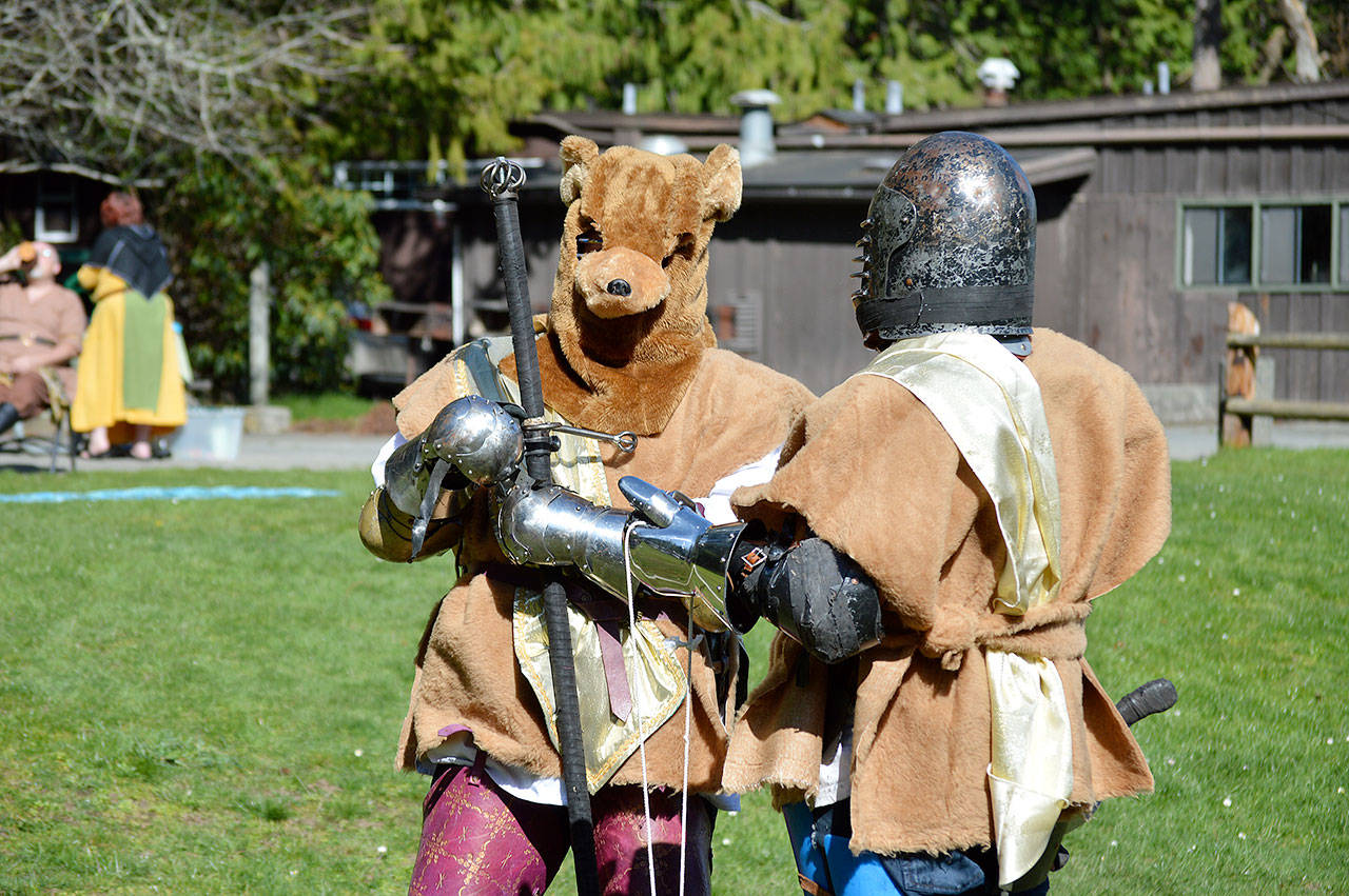 Two monsters chat after having their costumes judged and before being sent into the woods to be hunted by knights at Cornet Bay. Members of Empire of Medieval Pursuits met over the weekend at Deception Pass State Park to engage in historical and mythological reenactments. Photo by Laura Guido/Whidbey News Group