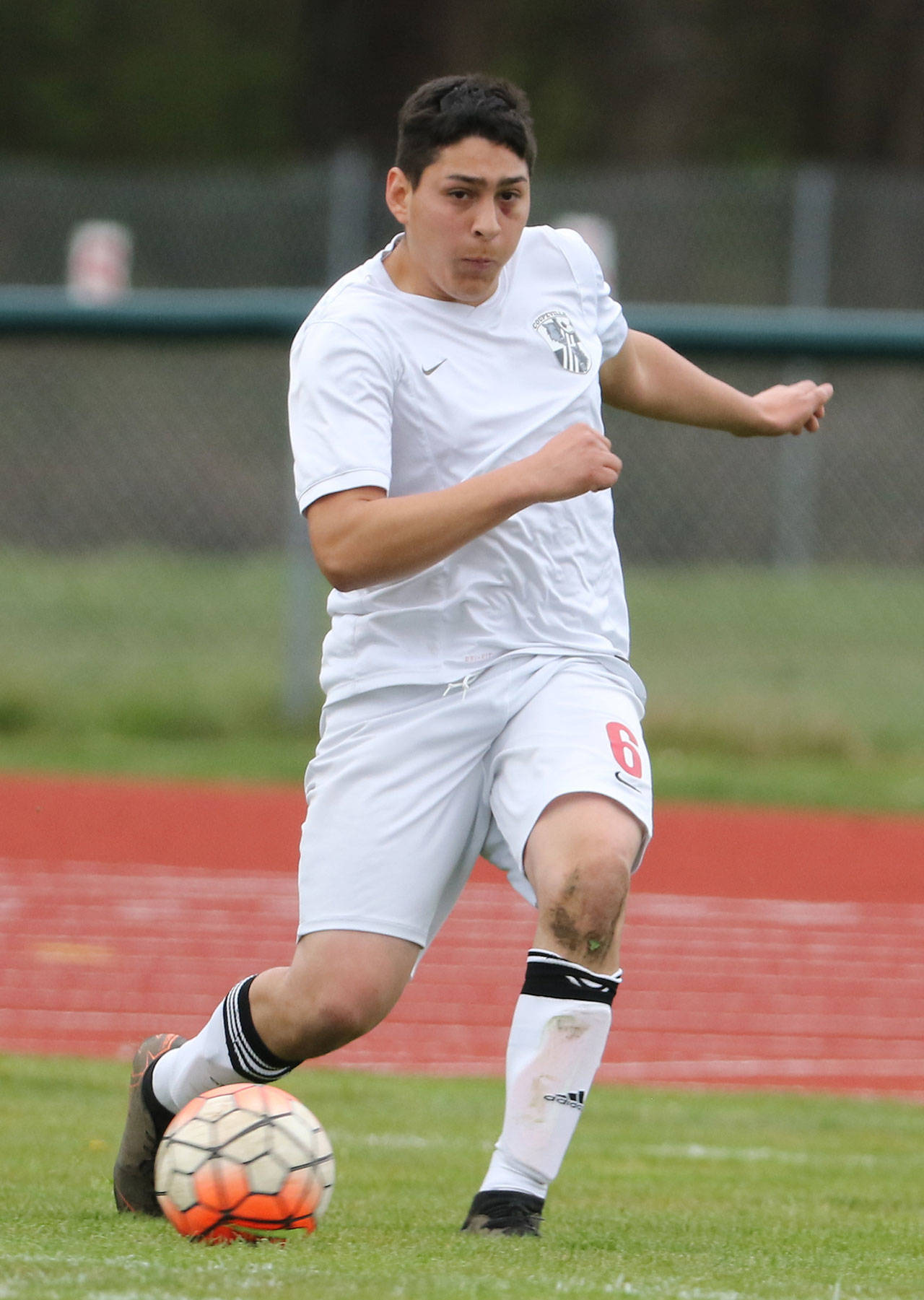 Axel Partida advances the ball for the Wolves in the Vashon Island match in Coupeville Monday. (Photo by John Fisken)