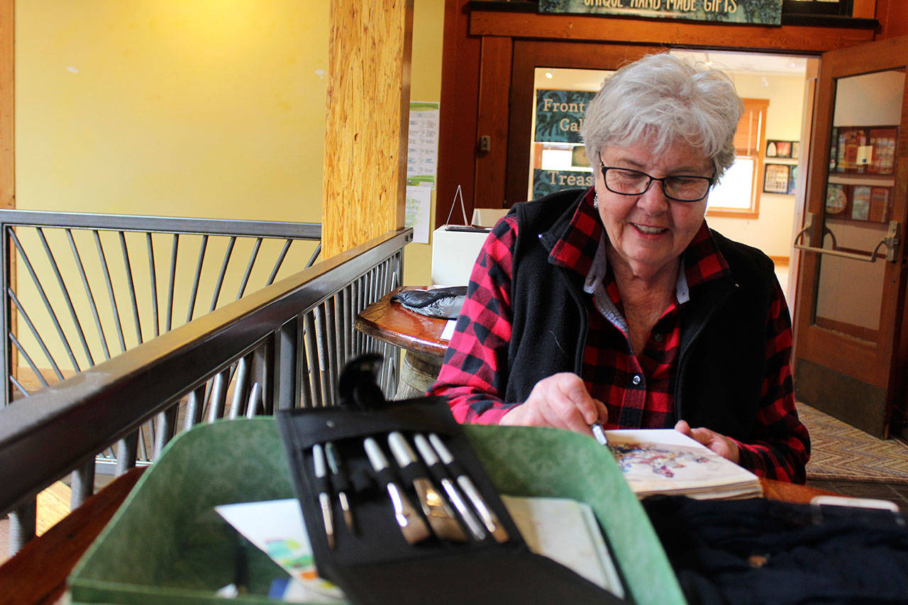 Pat Brookes said she didn’t know how to draw or paint before attending weekly meetings of Whidbey Island Sketchers. Now she keeps track of her travels with on-the-scene sketches. Photo by Patricia Guthrie/Whidbey News Group