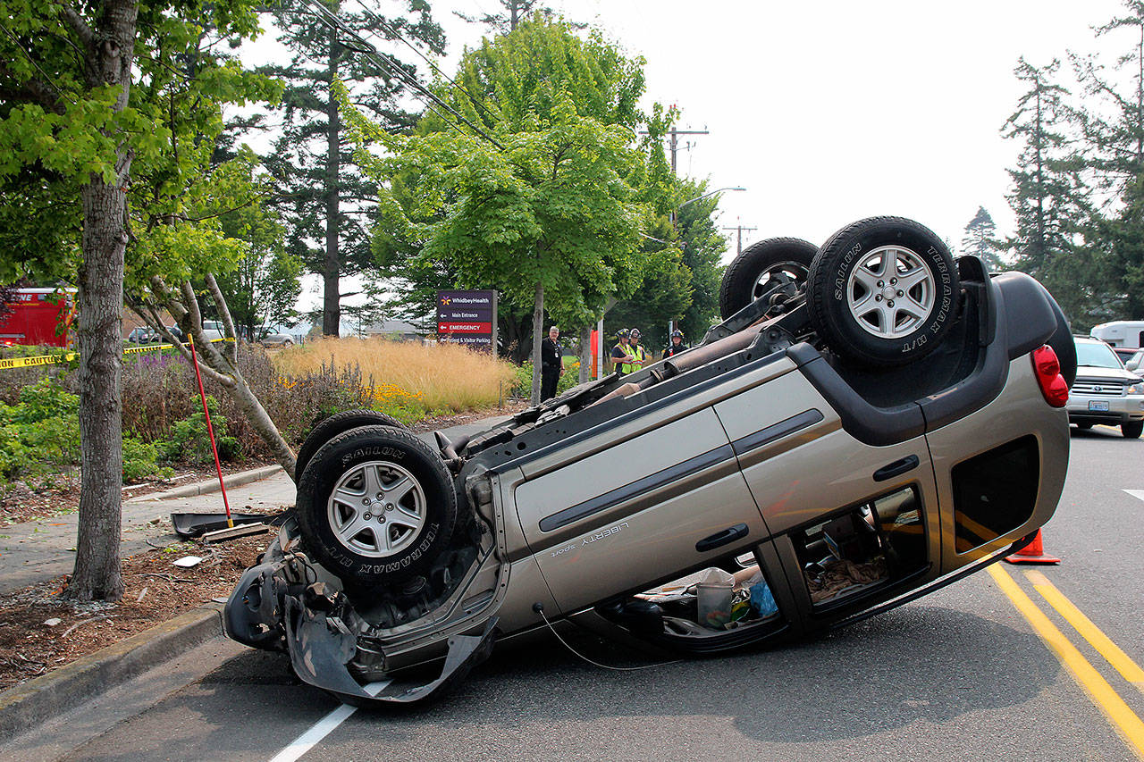 Photo by Jessie Stensland / Whidbey News Group                                A woman sustained minor injuries after a Jeep rolled on Main Street in Coupeville.