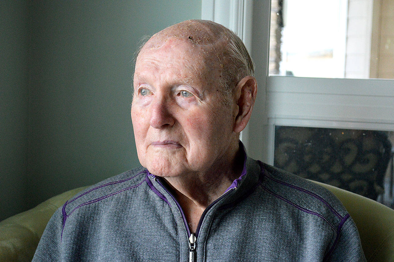 Longtime Oak Harbor resident Hank Koetje sits at his home overlooking the harbor. He served in WWII as an Army infantryman. Photo by Laura Guido/Whidbey News-Times