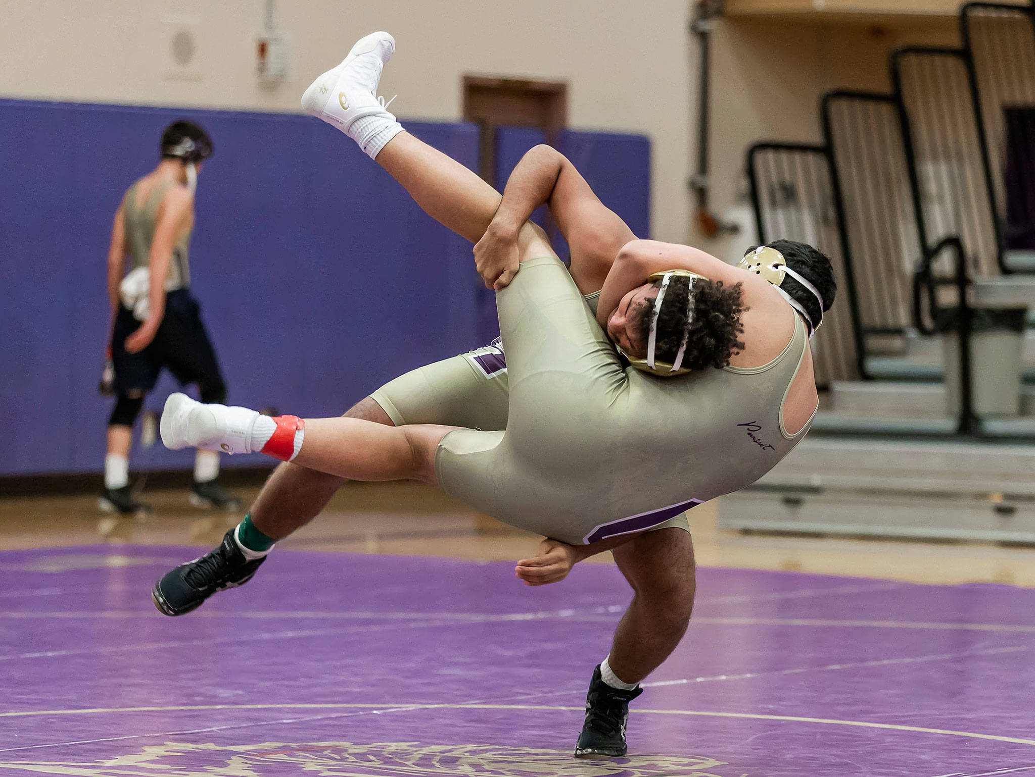 Brandon Liberty and Sal Tirado go airborne in Wednesday’s Purple and Gold Dual.(Photo by John Fisken)