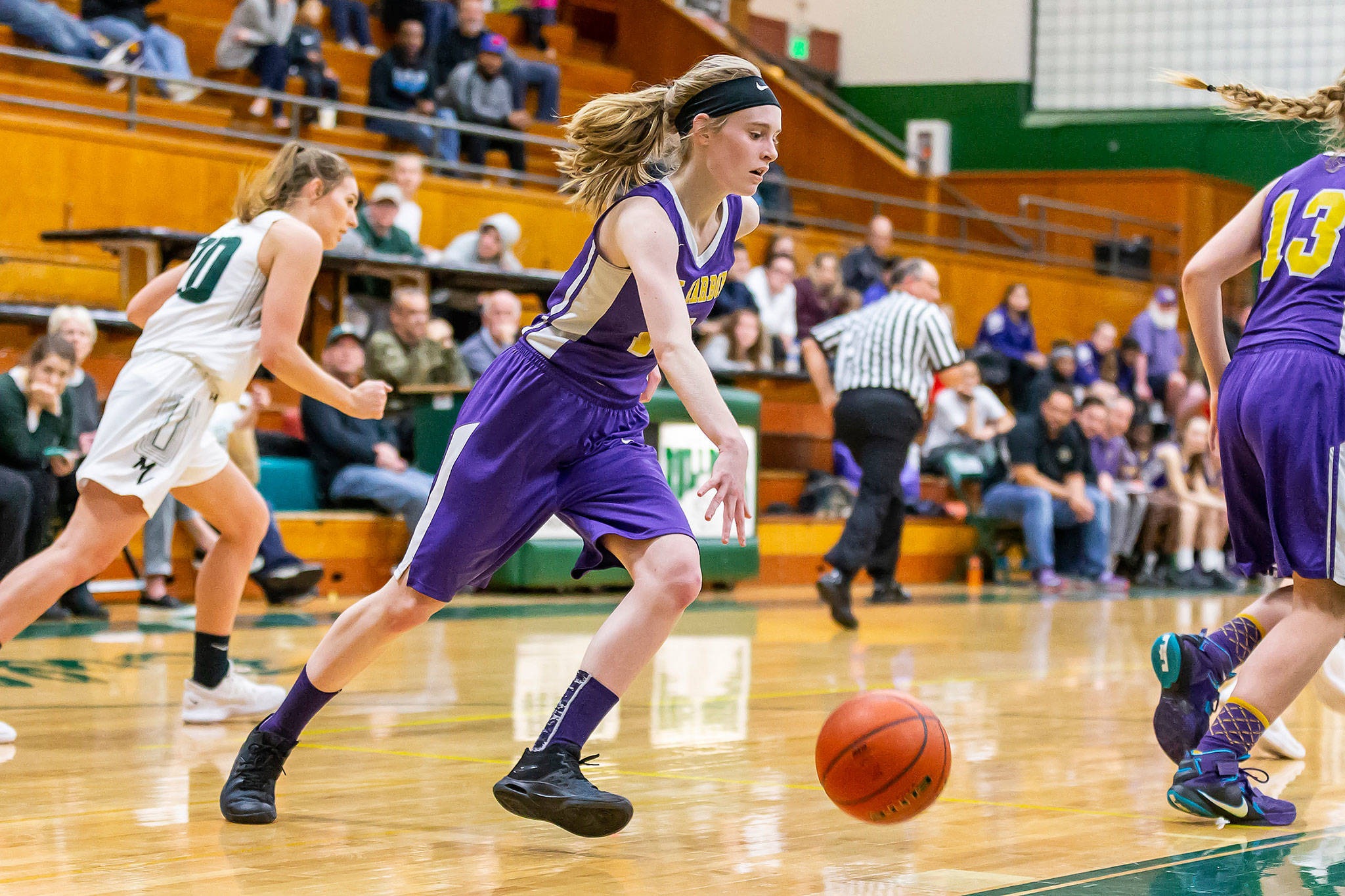 Olivia Waite heads up the floor to get the Oak Harbor offense going.(Photo by John Fisken)