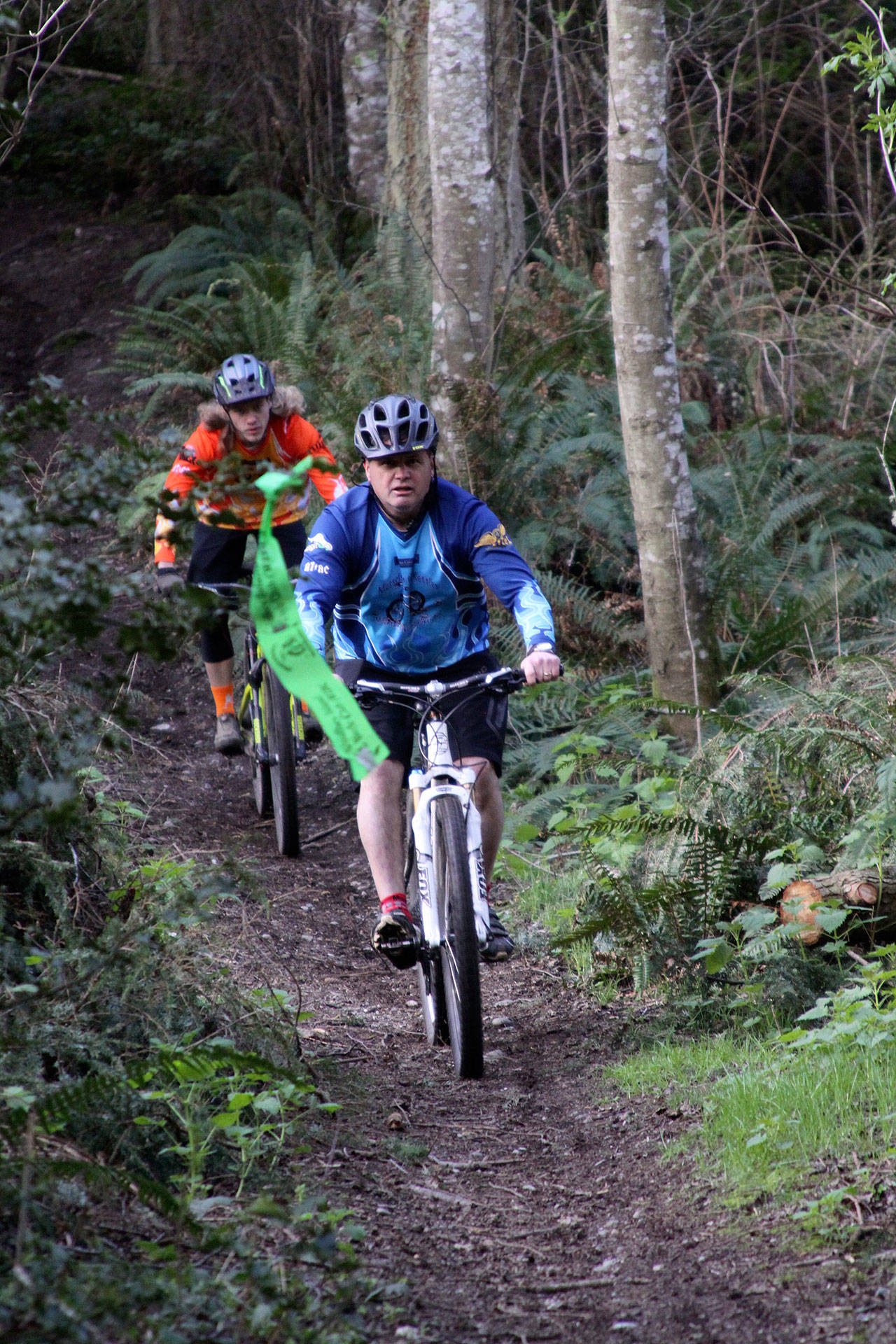 Matt Plush (front) and Brad Nelson test out the trails a week before the 2017 Mussels in the Kettles ride. Each year, the Whidbey Island Bicycle Club pre-stages and sets up the trails to prepare for the annual rides. (Photo provided)