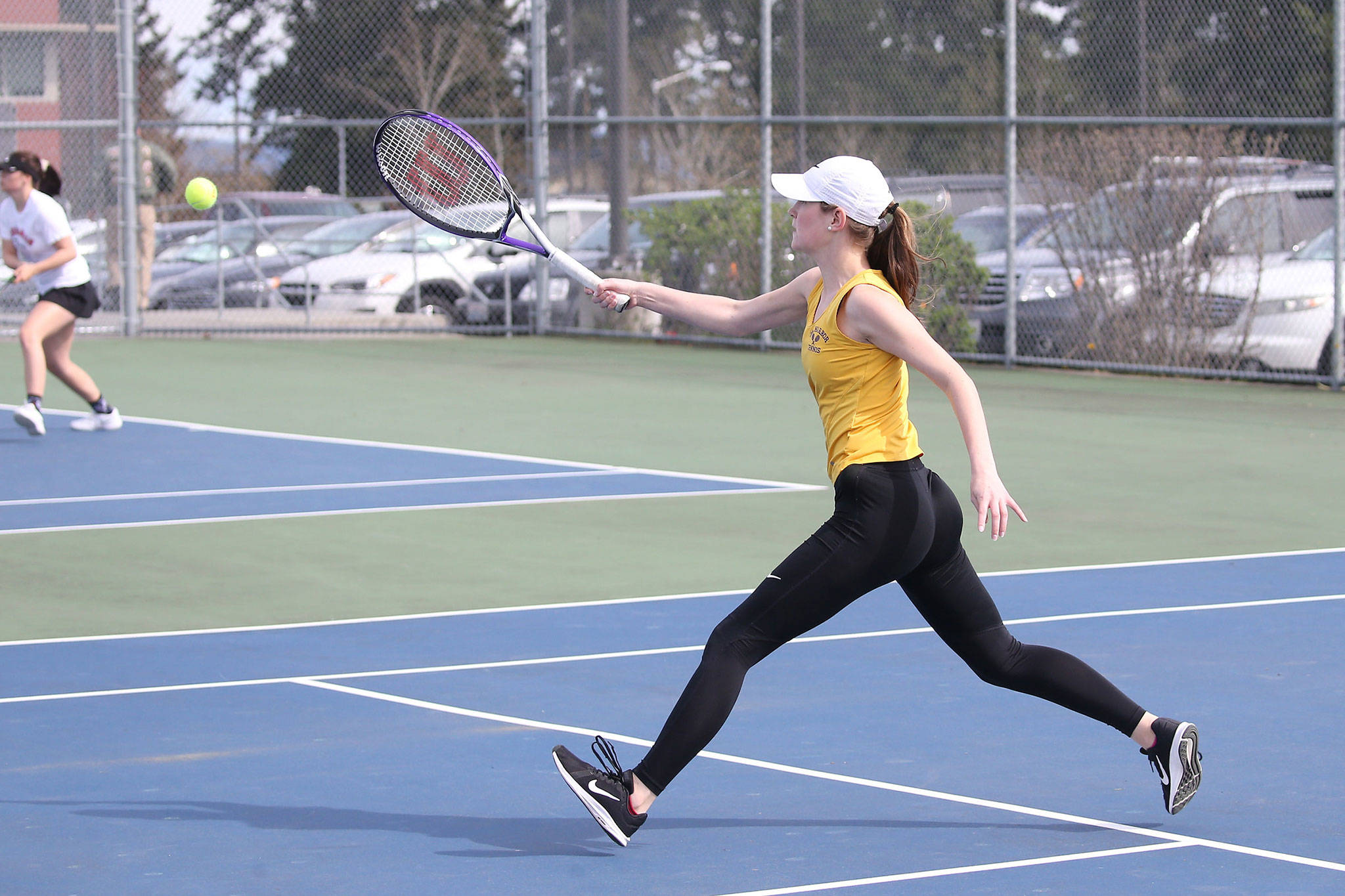 Oak Harbor’s Danielle Lonborg runs down a shot in her fourth singles match with Snohomish on Monday.(Photo by John Fisken)