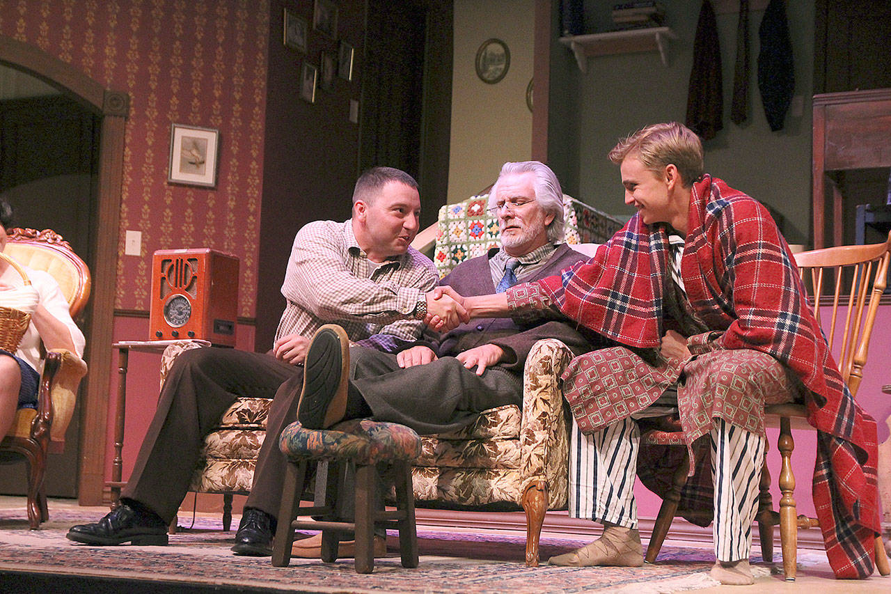 Photo by Laura Guido/Whidbey News-Times                                Far left, Stanley Jerome, played by Chris Kehoe, shakes hands with his brother Eugene, played by Ethan Webb. Their socialist grandfather Ben, played by Ben Honeycutt sits between them.