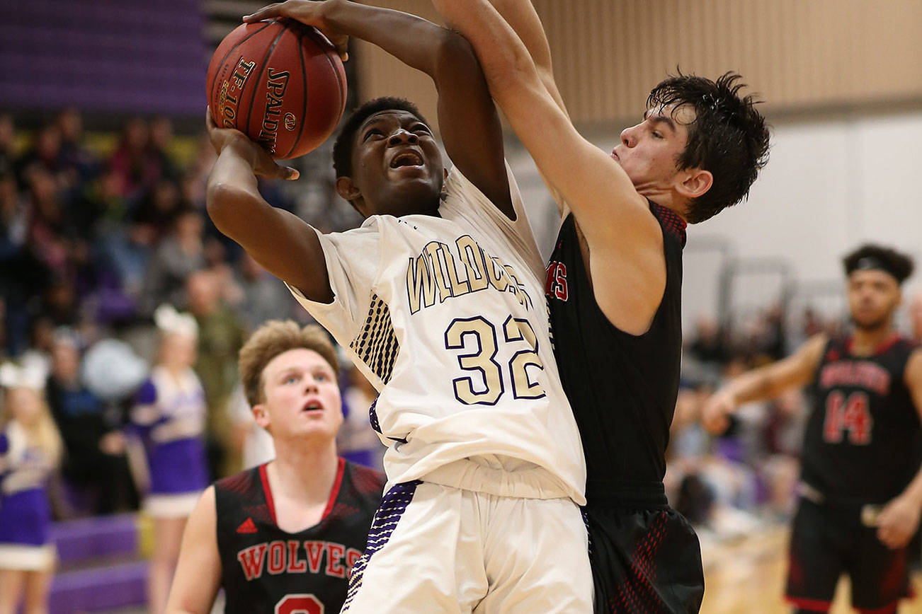 Oak Harbor edges Coupeville in OT / Boys basketball