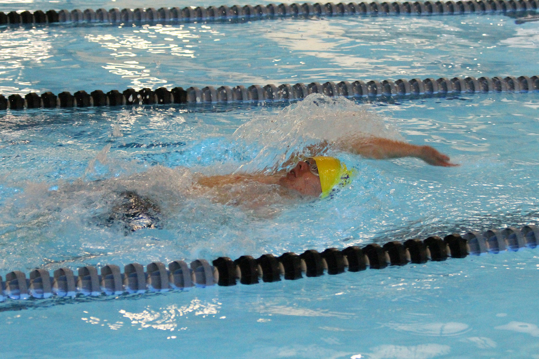 Micah Franklin swims the backstroke leg during his winning effort in the 200-meter individual medley.(Photo by Jim Waller/Whidbey News-Times)