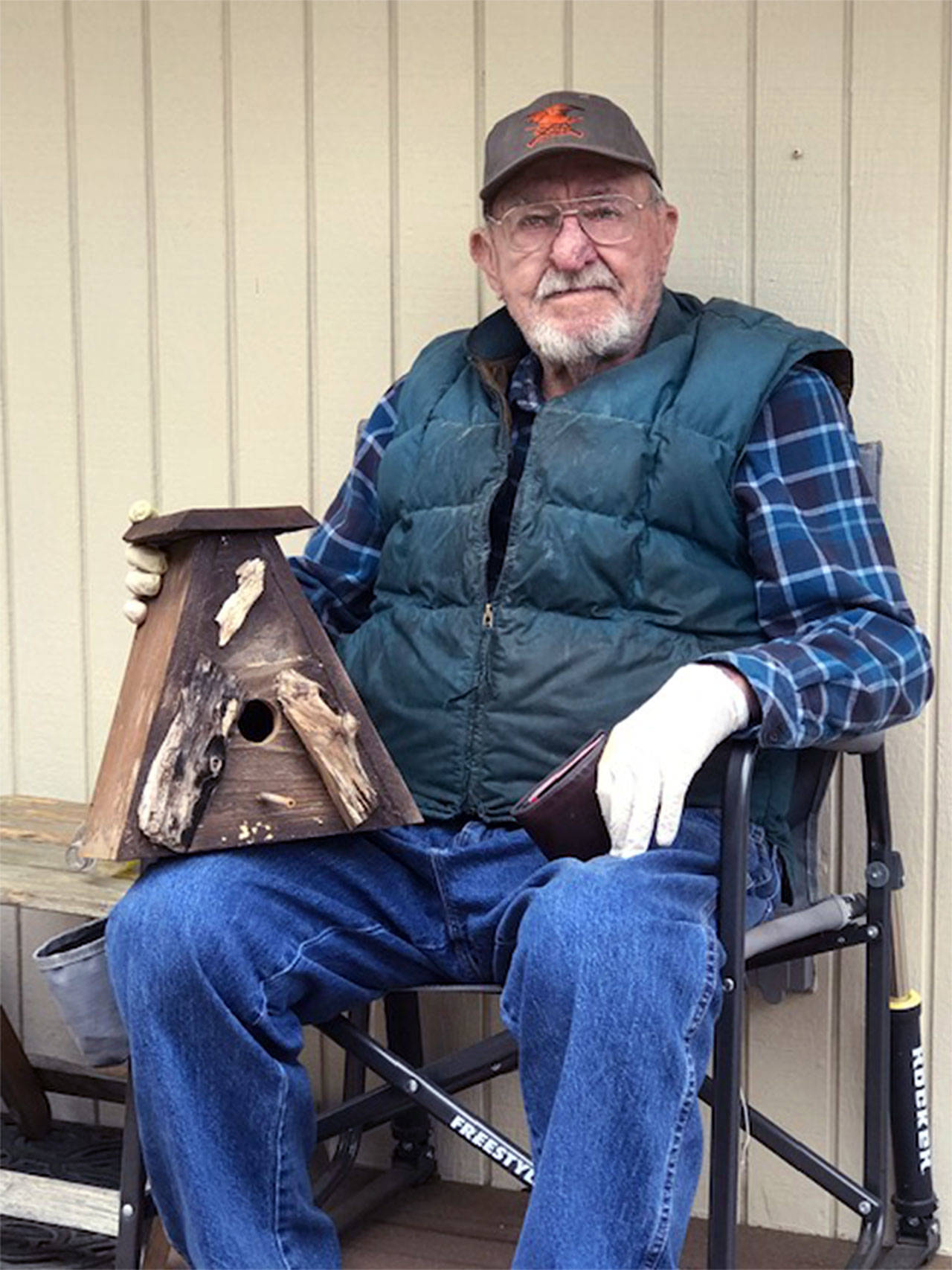 Lions member building birdhouses to help food bank