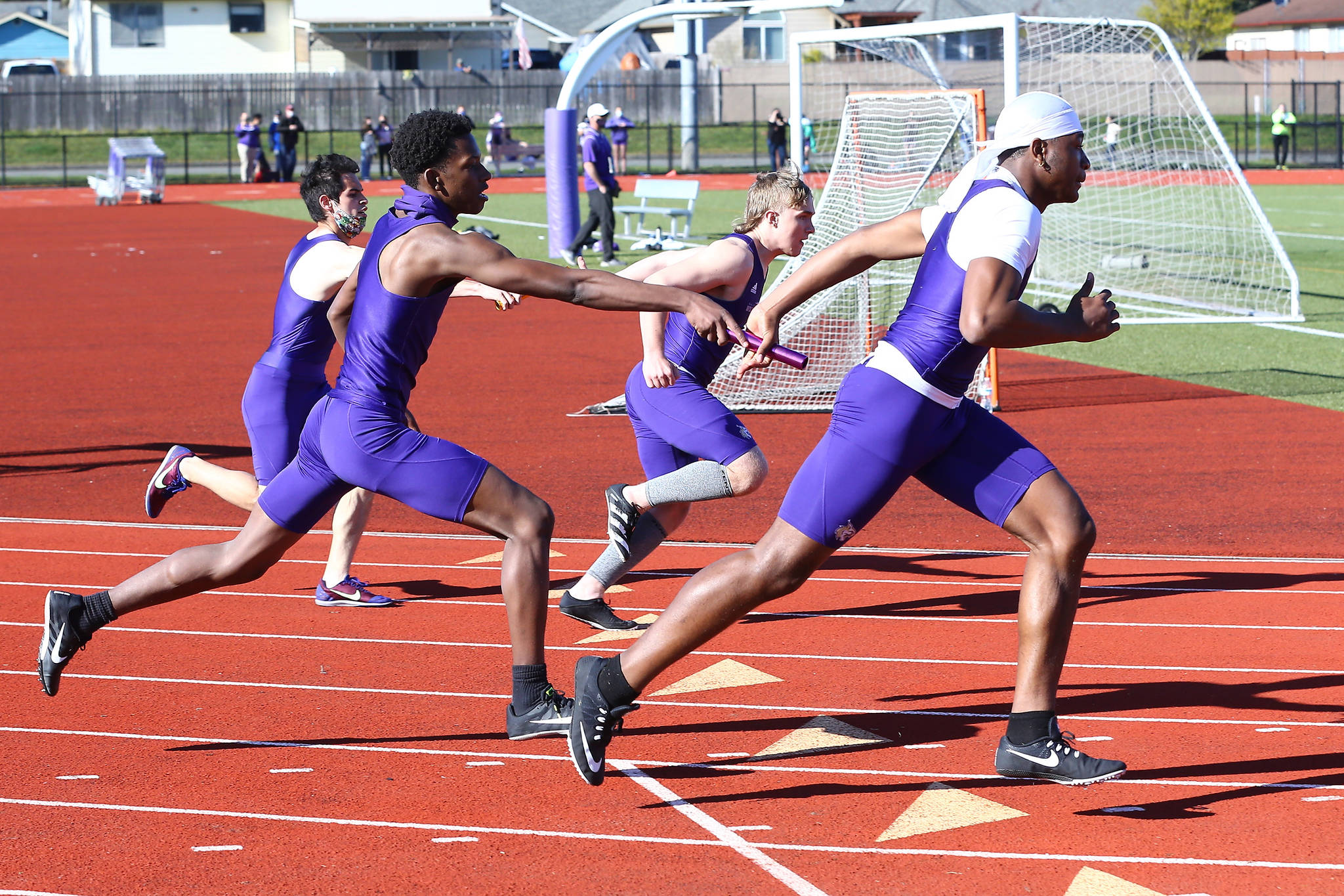 Oak Harbor High School track and field hosted Anacortes Wednesday. The Wildcats came in second in the 4x100 relay with 46.77 to the Seahawks 46.26. Overall, Anacortes bested the Oak Harbor boys and girls varsity teams, 155 to 115 and 220 to 80, respectively. (Photo by John Fisken)