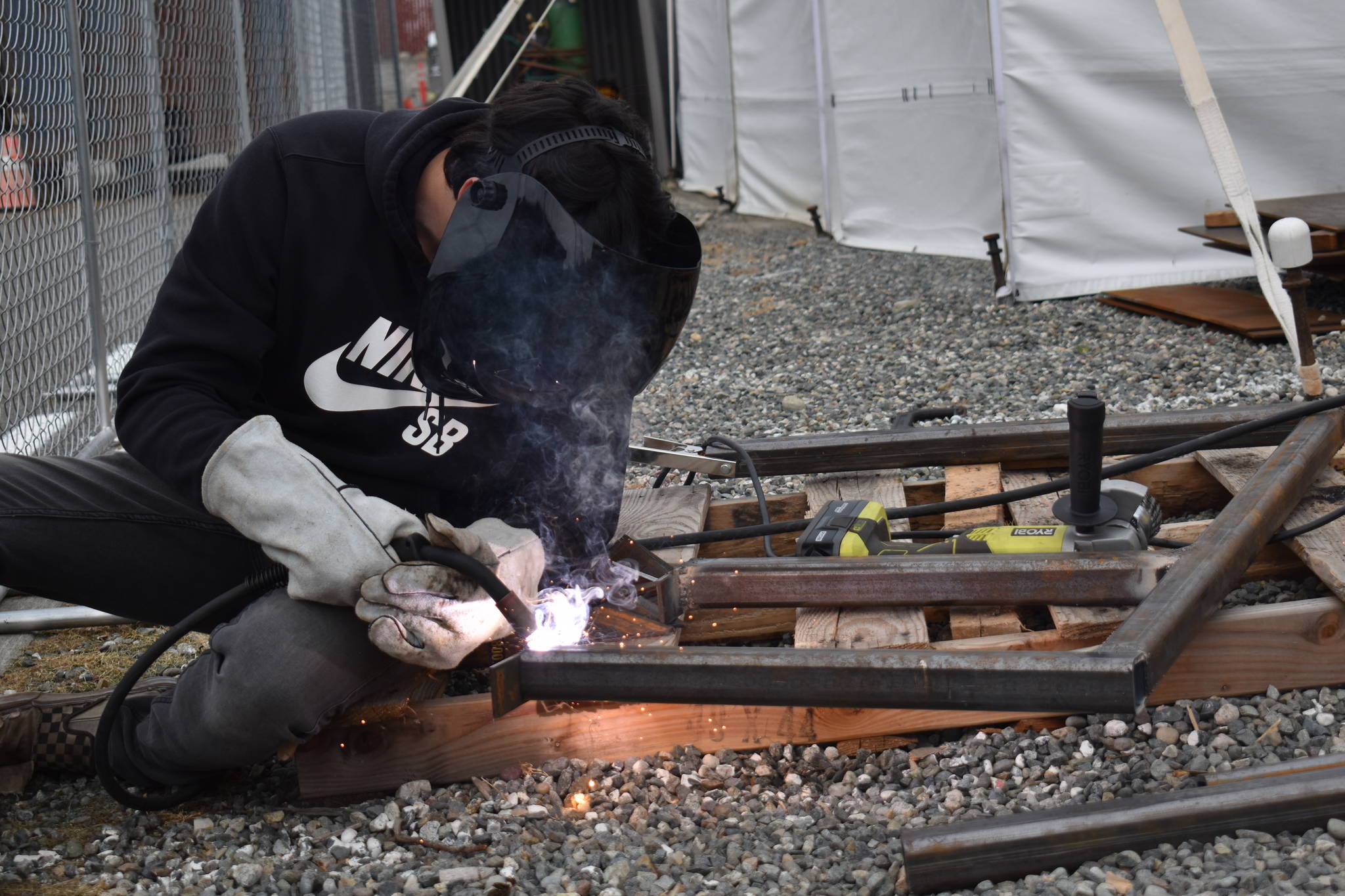 Photo by Emily Gilbert/Whidbey News-Times
Junior Michael McKinney uses an arc welder to make a trailer hitch for a shed the class is making.