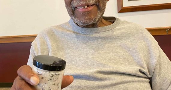 Resident Lorenzo Reid Sr. displays a jar of homemade epsom salt bath soak. (Photo provided)