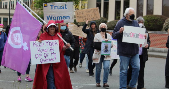 Whidbey residents took to the street Tuesday in Coupeville to rally for abortion rights following the leak of a Supreme Court draft opinion that indicated the court intends to overturn Roe v. Wade. (Photo by Karina Andrew/Whidbey News-Times)