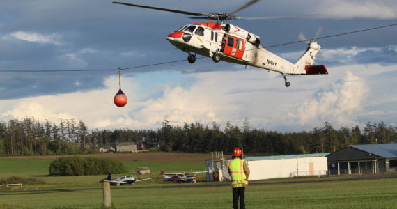 Navy Search and Rescue lands a Sikorsky MH-60S Nighthawk during Monday’s training. Naval Air Station Whidbey Island Search and Rescue has two MH-60S helicopters and can conduct both overwater and mountain rescue including helicopter rappel, hoist and mountain landing. (Photo by Karina Andrew/Whidbey News-Times)