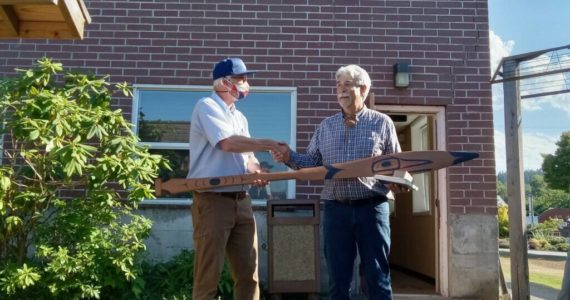 Photo provided
Mel Sheldon, right, presented Langley Mayor Scott Chaplin with an intricately carved and painted paddle Monday afternoon.