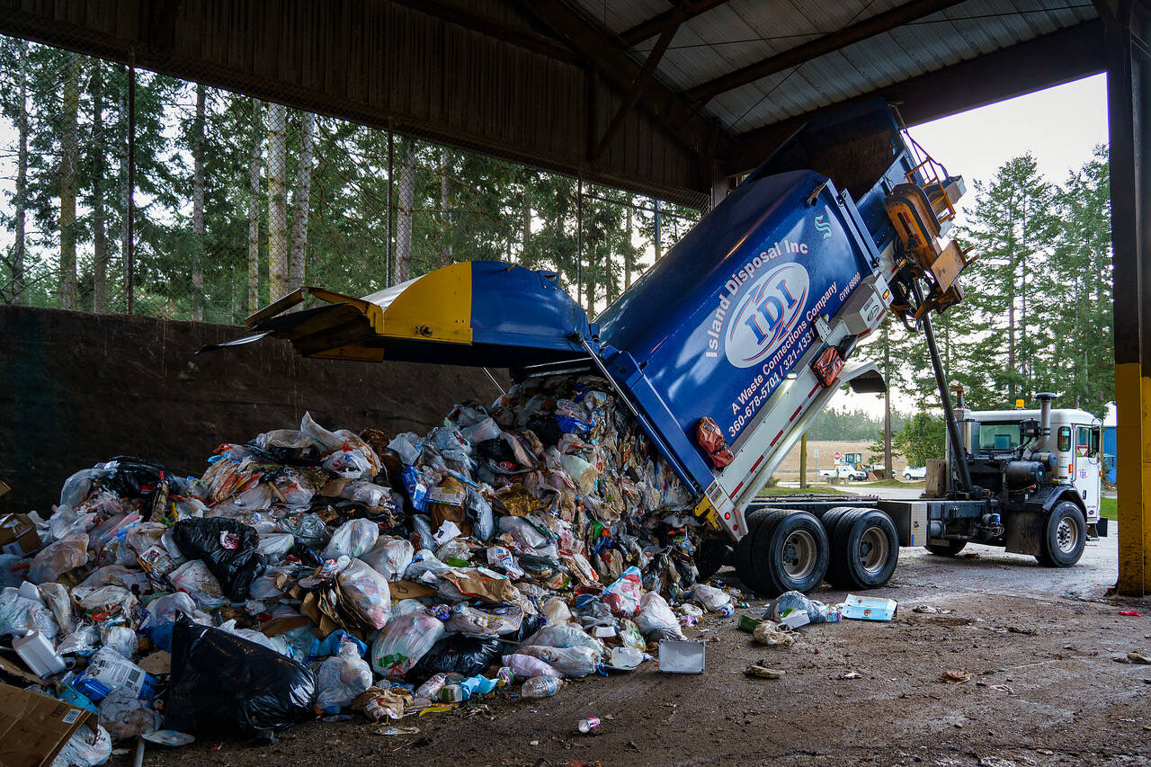 Garbage is dumped off at the county transfer station, which could possibly get an updated trash compactor someday. (Photo by David Welton)